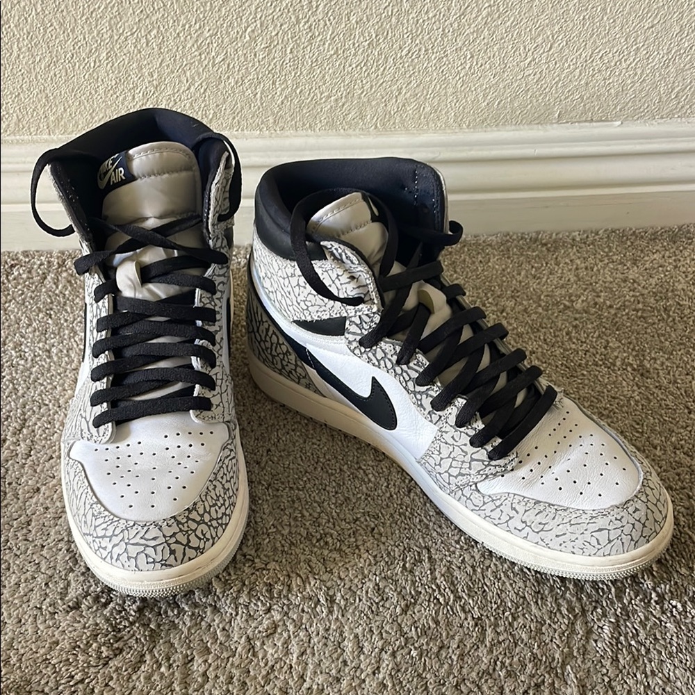 Nike Air Jordan’s Black and White High-Top Sneakers with Metallic Accents